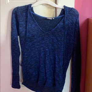 a shirt that has a hood on it